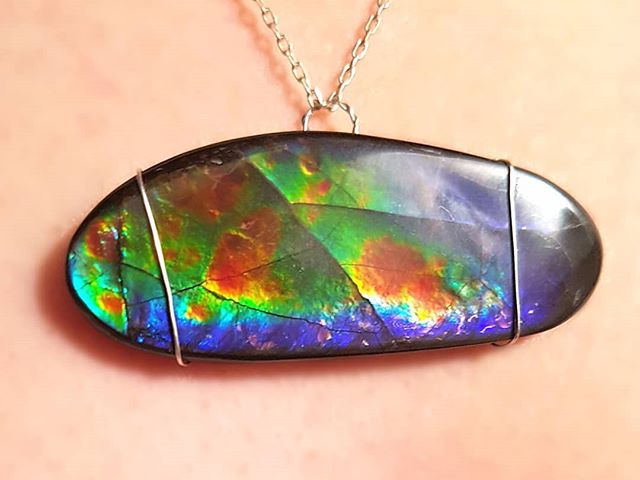 I got my hands on a really spectacular  piece of ammolite and tried my hand at wire wrapping it.

Ammolite only comes from one place in the world, the Bearpaw Formation in southern Alberta. I like having such a colourful gem come from so close to hom