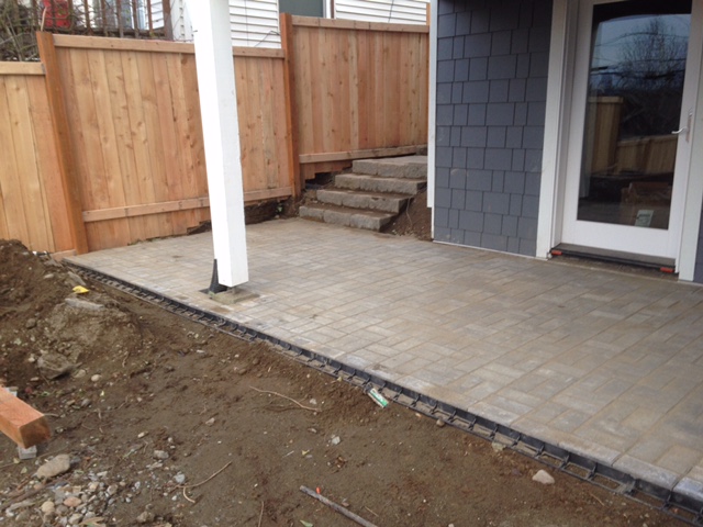 Pavers are laid and filled with sand