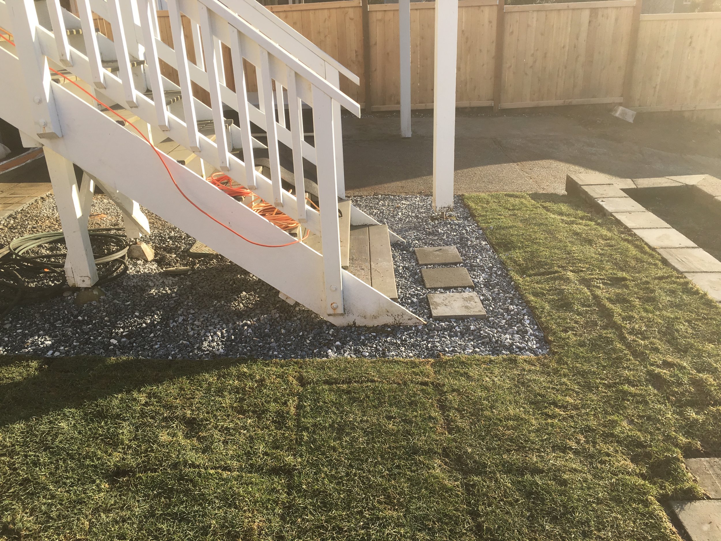 New sod and salt/pepper gravel with edging.