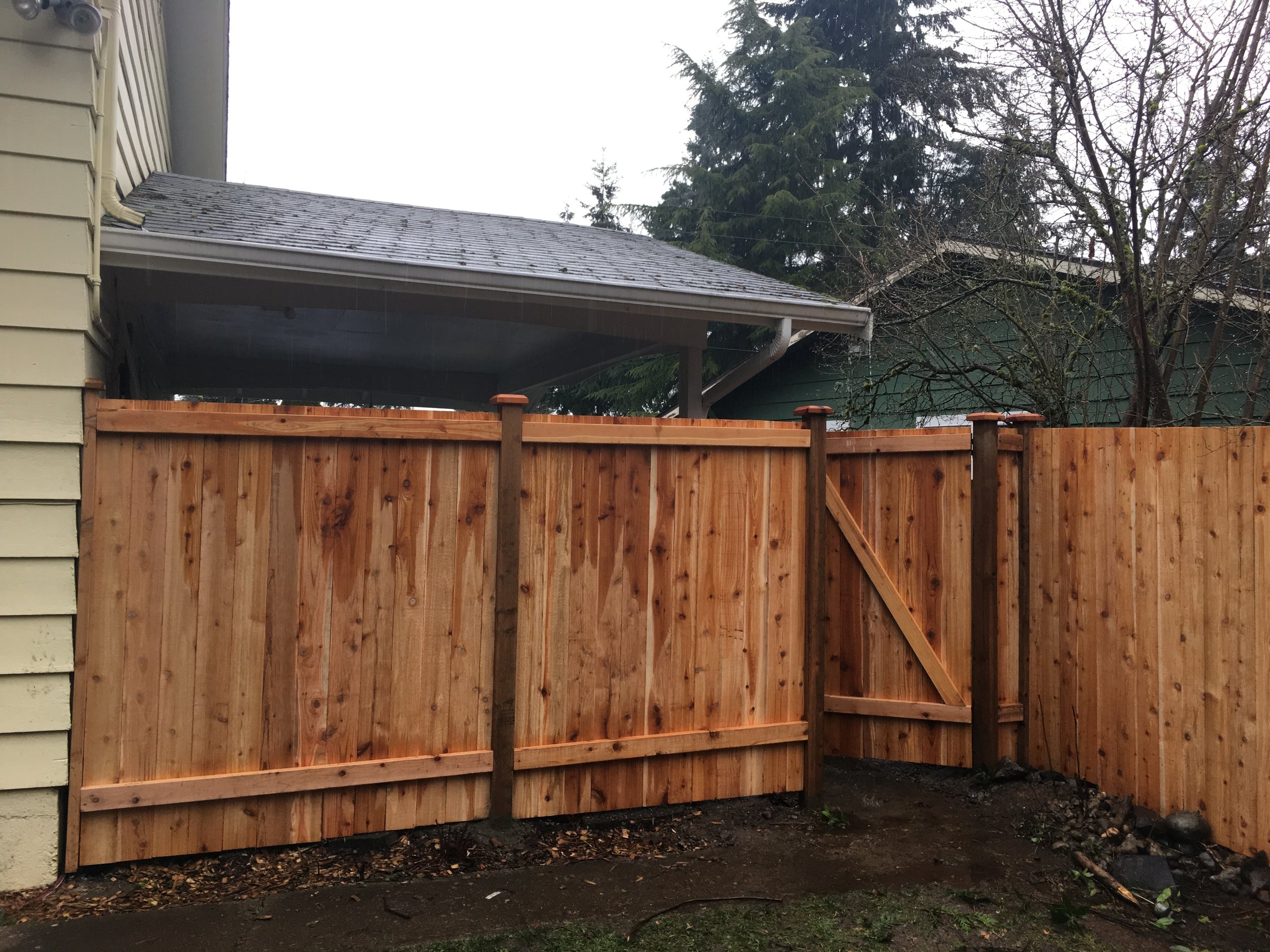 Removed chain link fence and replaced with new cedar fencing