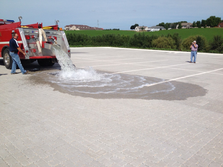 Monona Fire Department’s demonstration of the infiltration characteristics of the permeable parking lot. Photo contributed by Eric Palas.
