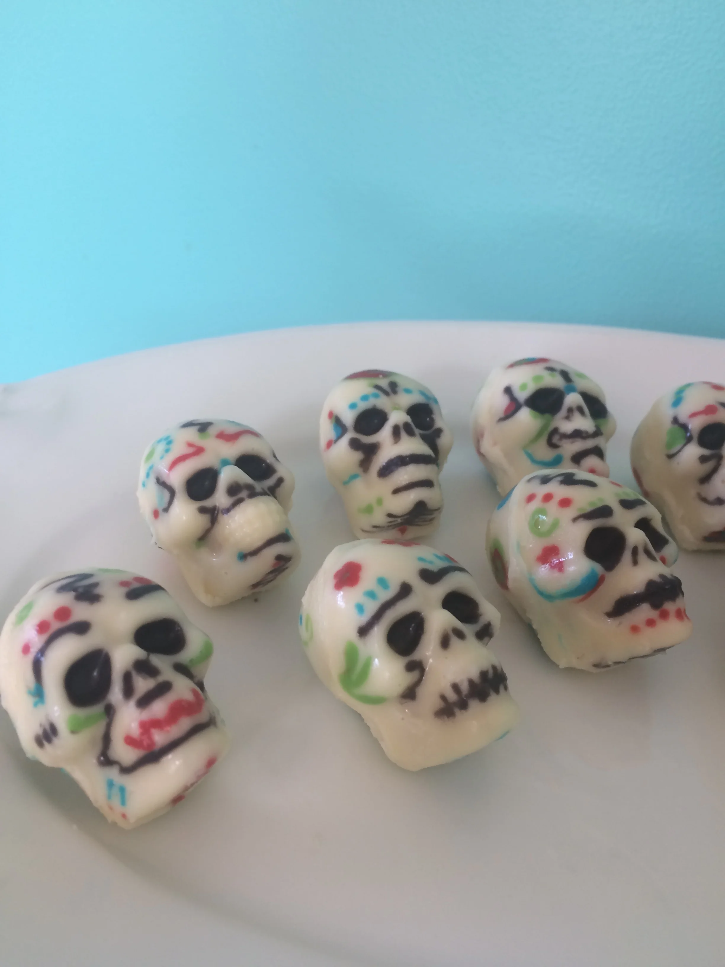  Hand-painted chocolate skulls filled with red wine mascarpone, pine nut, basil, and honey 