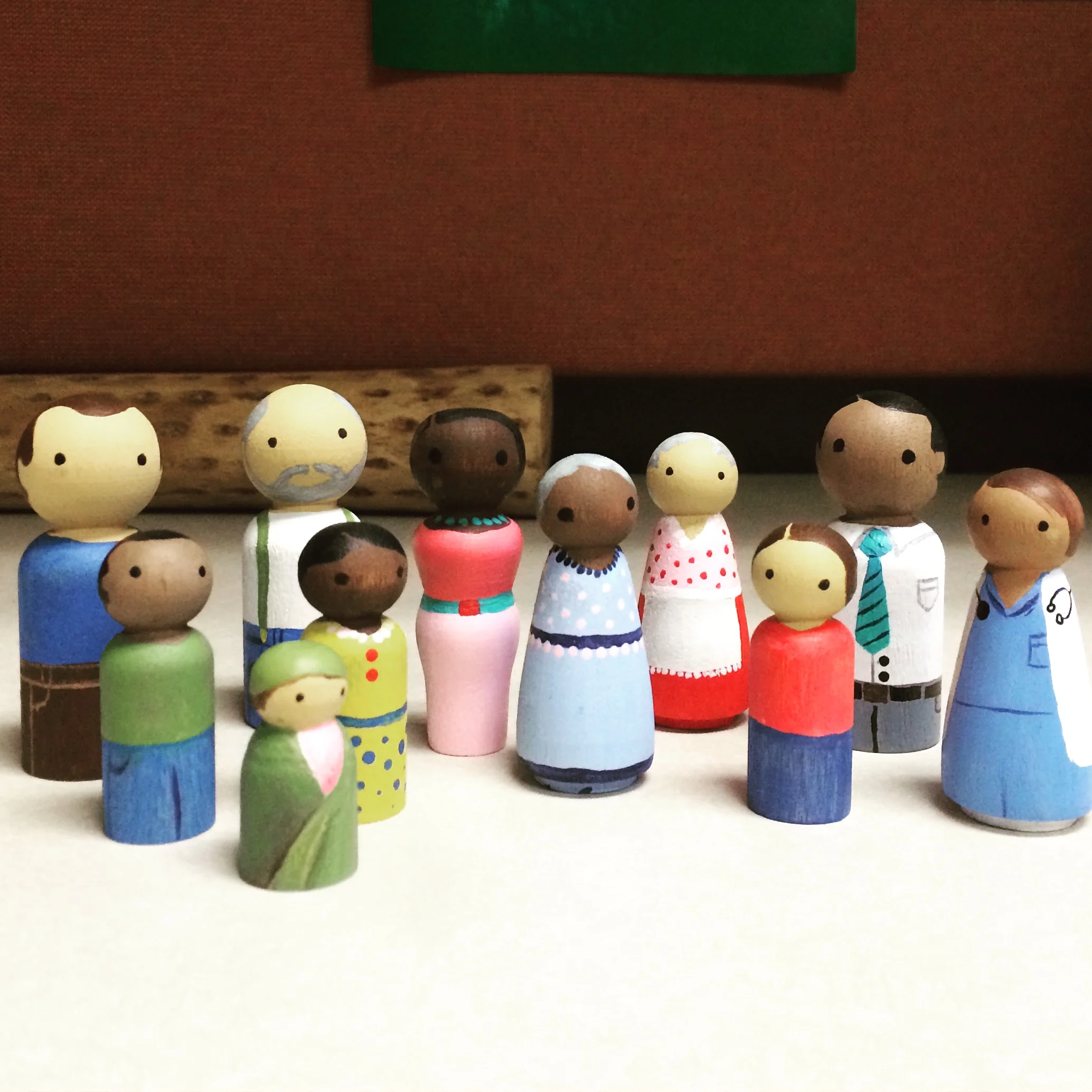  Hand-painted peg people, who live in the art therapy office 