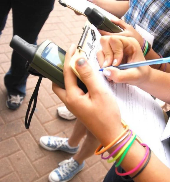 Middle school and high school students learning how to use GPS and collect data during a geocaching treasure hunt in downtown Flagstaff, Arizona. Photo credit: James Bauerle