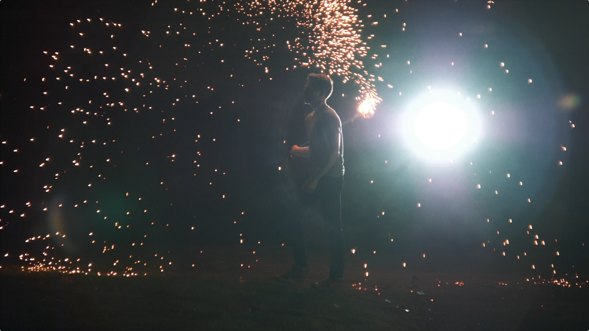 strong backlight photo from our indie music video with steel wool sparkler