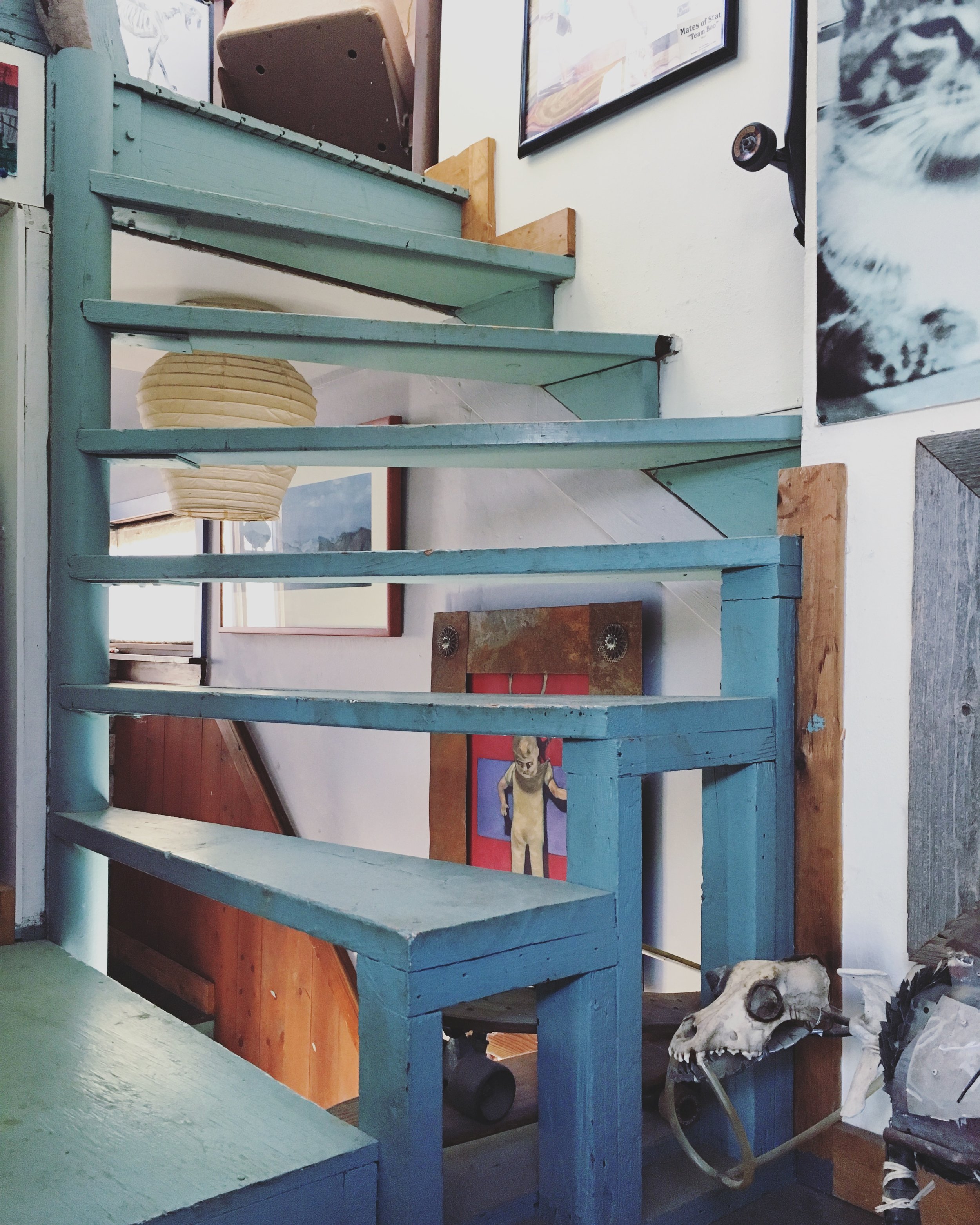 THIS STAIRCASE AND JOHN'S ART AROUND IT AND IN THE HOUSE IN GENERAL ARE AMAZING. Also- seriously- the color of the stairs is what dreams are made of.
