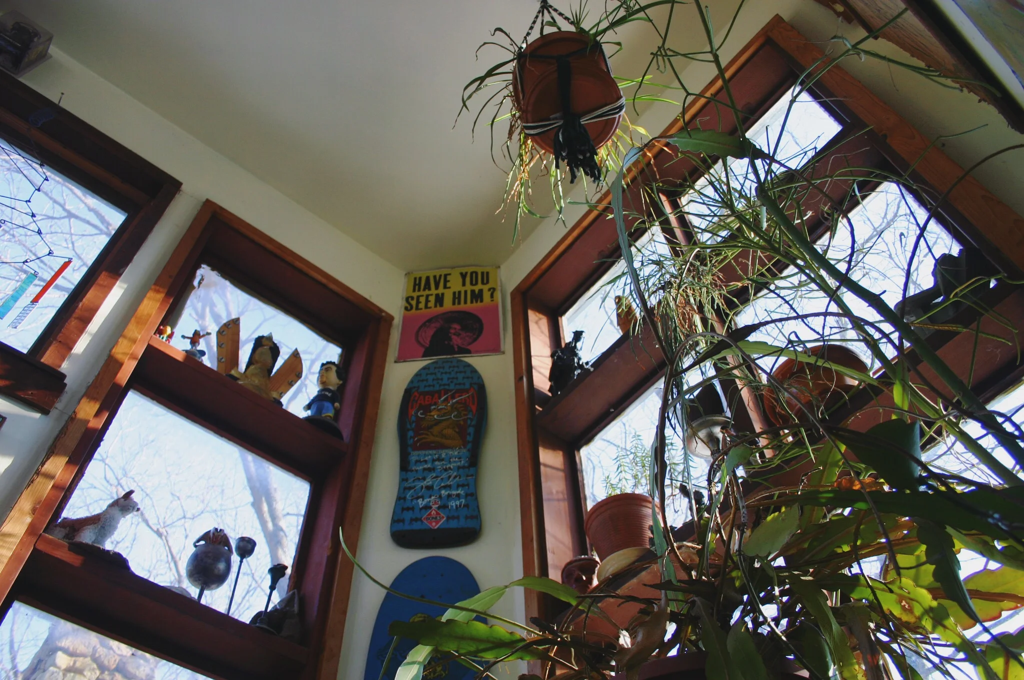The windows in the stairwell to the studio are so. beautiful. Evidence of John's past as a skateboard shop owner in Lawrence, KS are prevalent throughout the property.