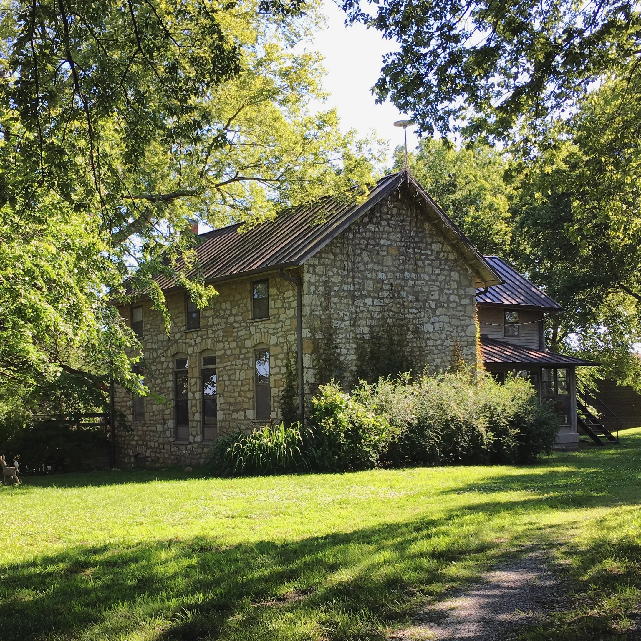 The view driving up to the property. Sitting on many acres just north of Lawrence, Kansas, the Zimmerman house is surrounded by an outer ring of farmland and an inner ring of trees. In the dictionary of my mind, next to 'homestead,' there is a photo…