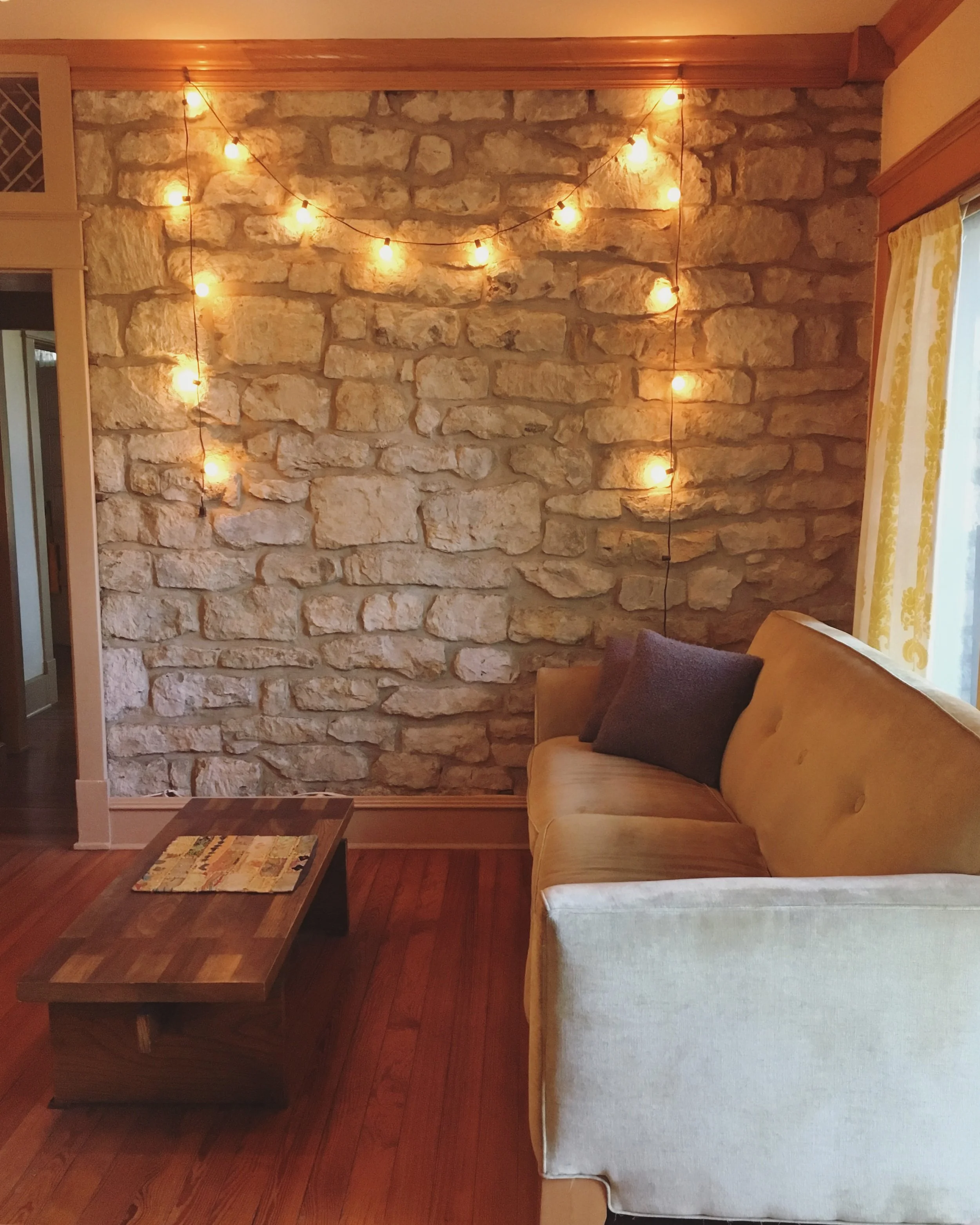 The limestone interior wall indicates where the original limestone structure ends and the more modern addition begins. Mind you- the word 'modern' is to be taken lightly- I haven't the foggiest as to when the house was expanded but based on the wood…