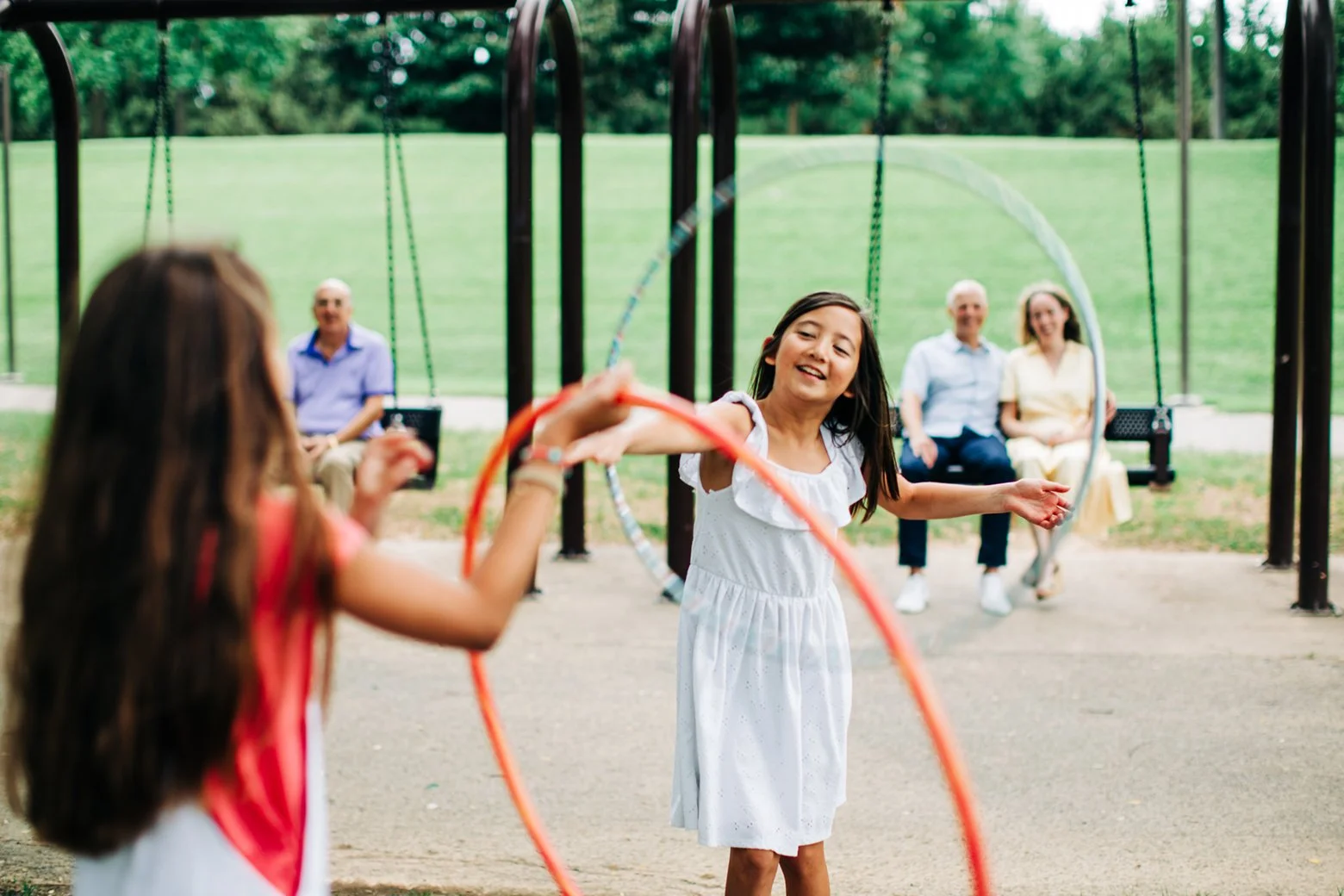  Kids playing with a hula hoop in Louisville, KY on the waterfront for Live in Louisville campaign  