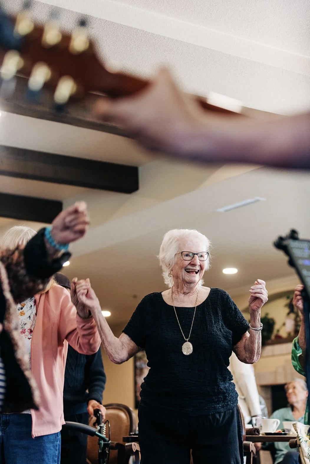  Resident dancing to a live band at an Atria senior living in CA  Kentucky photographer  