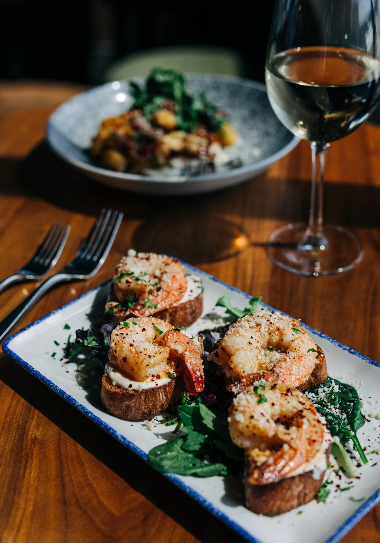  Plate of appetizers and wine for a local Louisville, KY restaurant located in the Galt House called Swizzle  