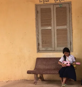 girl plays ukulele alone cropped.jpg