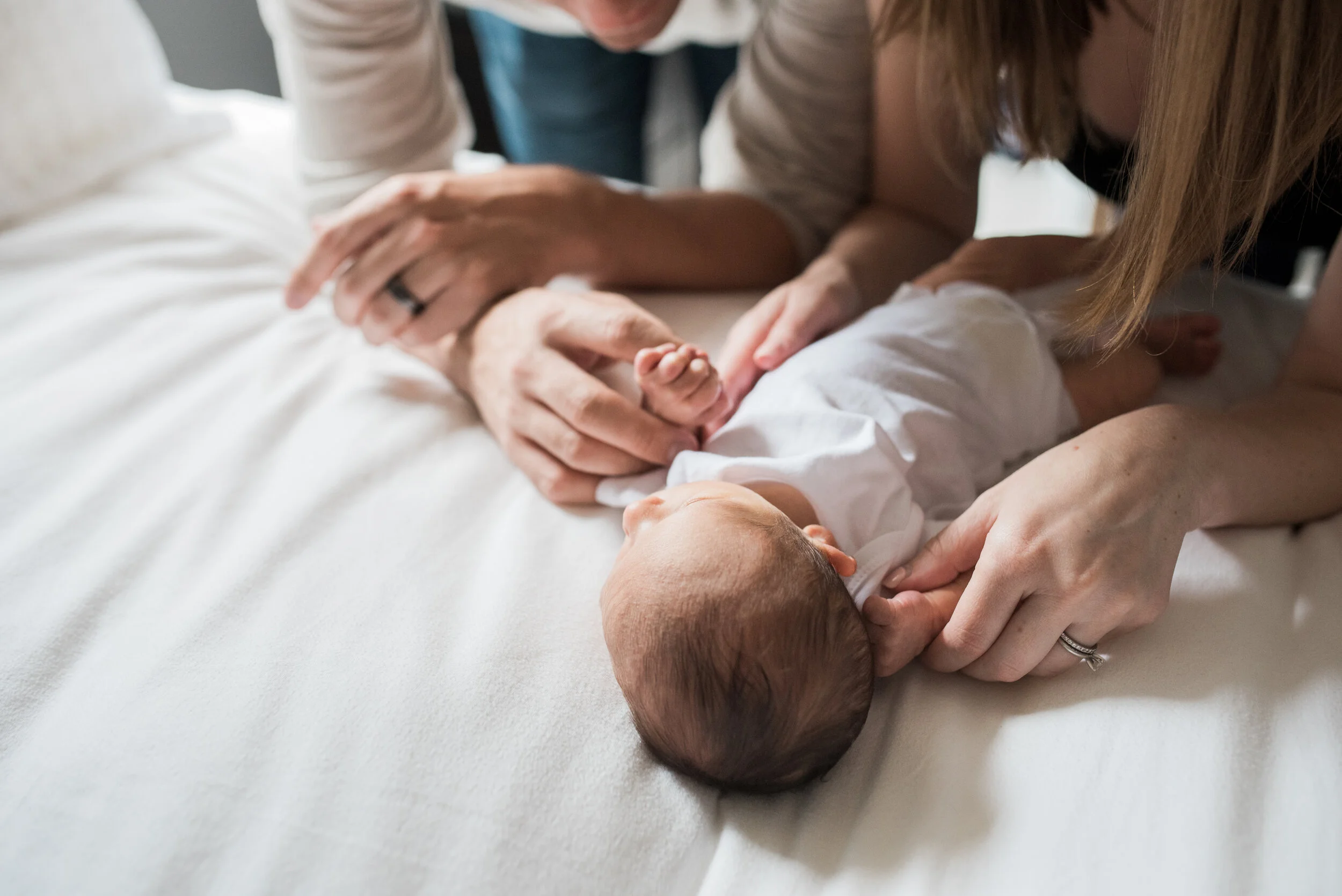 baby held by parents, Penny Lane Lifestyle Photography, Natural Light Photographer
