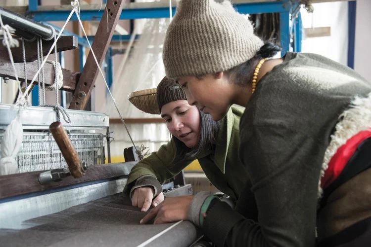 Yeshi instructs an artisan.