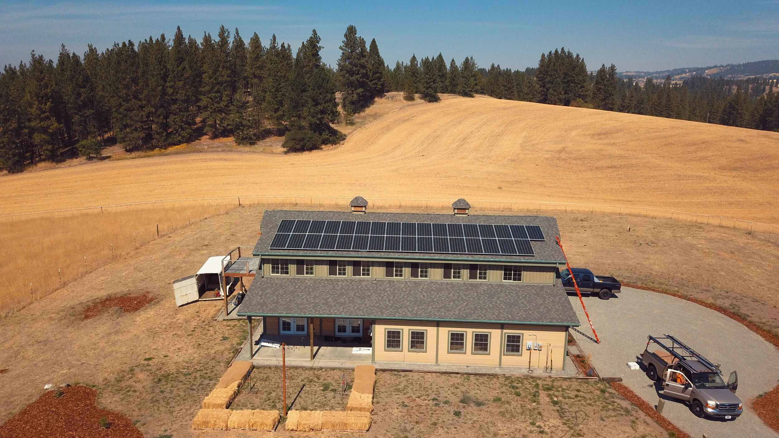 Rooftop solar installed on a barn offsets power for the whole property.