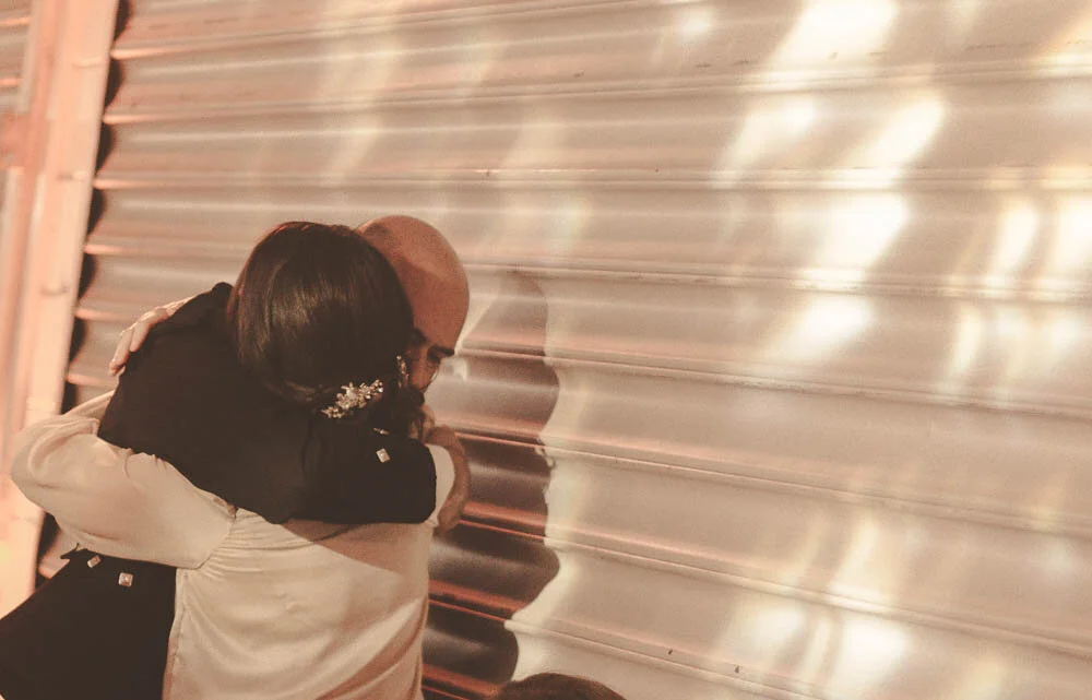  Father embraces his newly wed daughter 