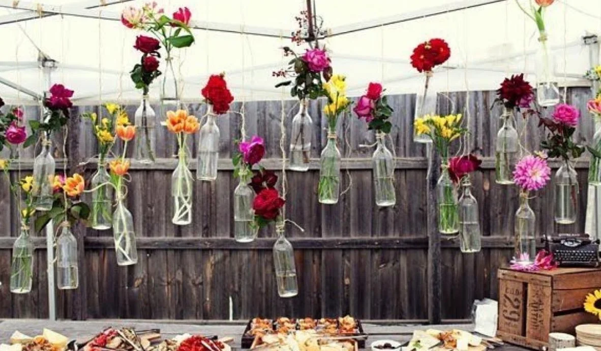 @upcyclethat turns empty glass bottles into beautiful hanging vases for holiday tables. Picture: MakeSmthngWeek.
