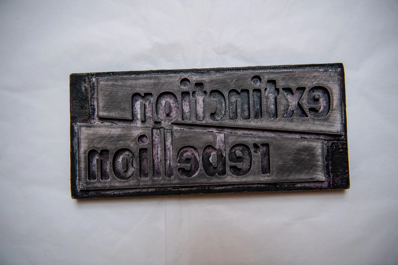 A 3D-printed Extinction Rebellion logotype block. Photo: Chris J Ratcliffe/Getty Images for The V&A.