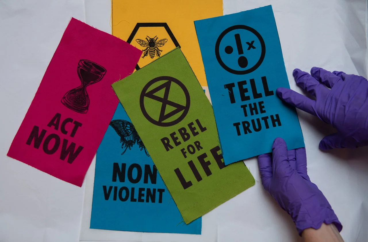 Brightly coloured patches are designed to be worn as a quick and easy to show allegiance during mass protest. Photo: Chris J Ratcliffe/Getty Images for The V&A.