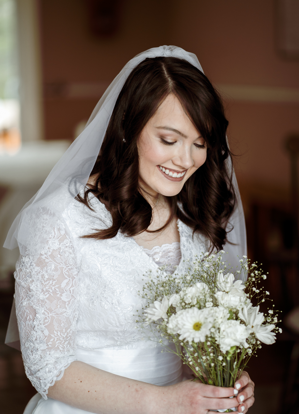So the flowers. They’re actually from a local grocery store. Flowers really weren’t a huge deal for me, so my bouquet is a simple mixture of baby’s breath and white wildflowers and arranged by my mom and bridesmaid Mandie.