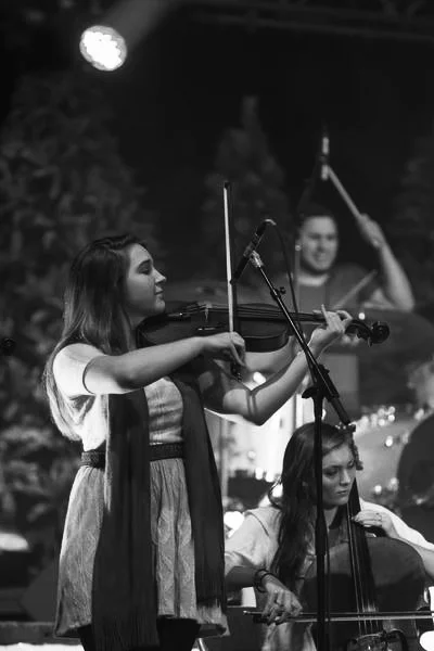 Playing Viola, as part of Atlas Rhoads at Christmas Coffeehouse as a student, December 2013.