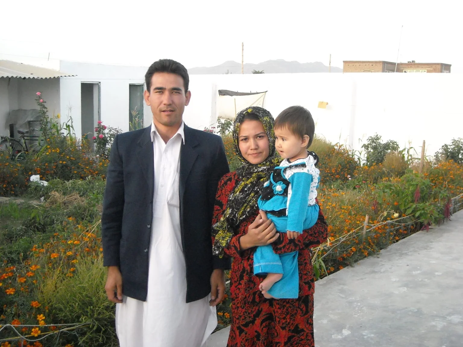 Aziza with her late husband Hassan and daughter.