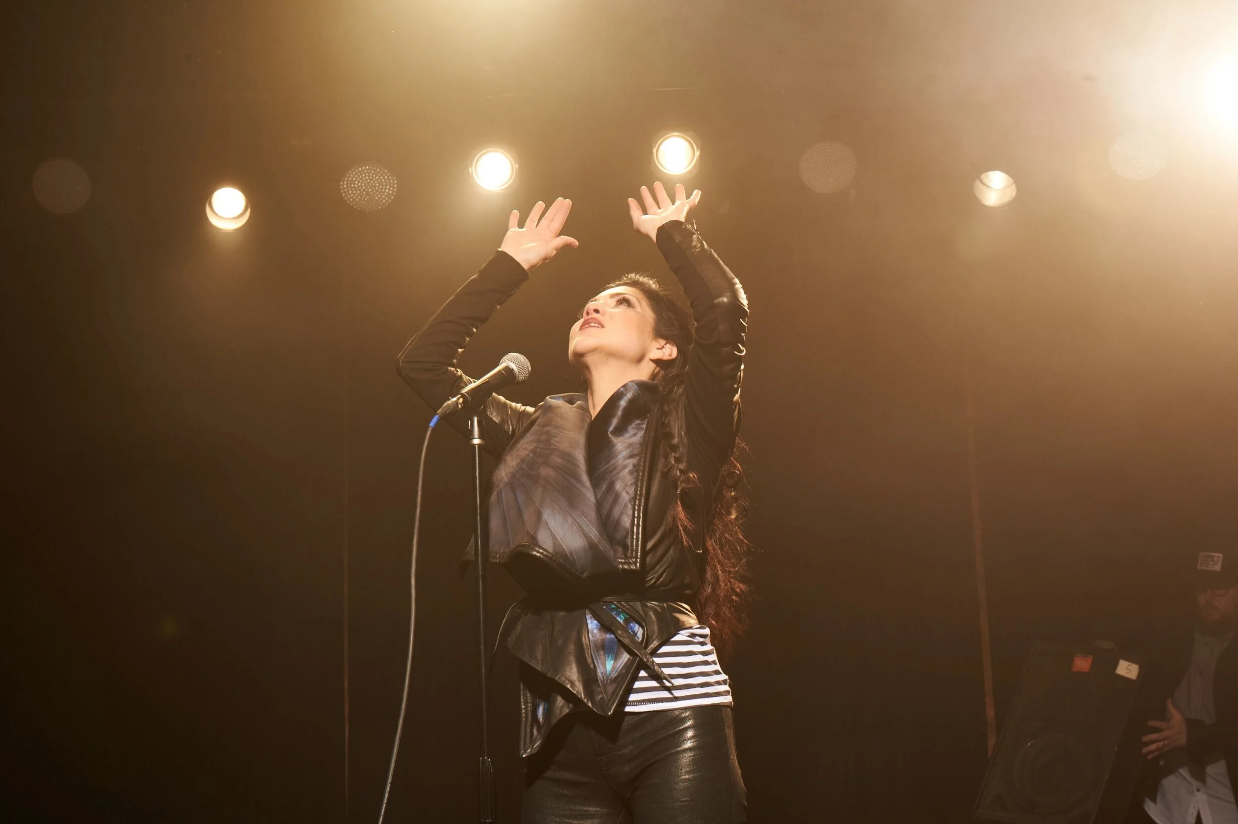 Jaci Velasquez performing at a concert. Photo by Allen Clark.