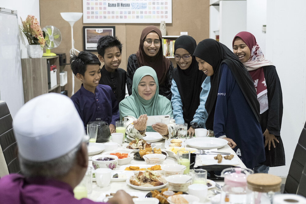  Isfadiah and her family have an online group call with relatives from other towns in Malaysia during the fast breaking in their house in Kuala Lumpur on May 22. “We would usually gather with our extended family in my mother’s house in Kedah a few da