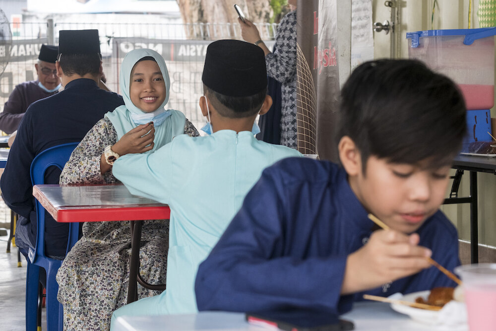  Employees of an NGO in Kuala Lumpur and their close families eat together on the morning of the first day of Eid al Fitr. Many people could not travel to their original villages and be with their extended families for the Eid al Fitr celebrations be