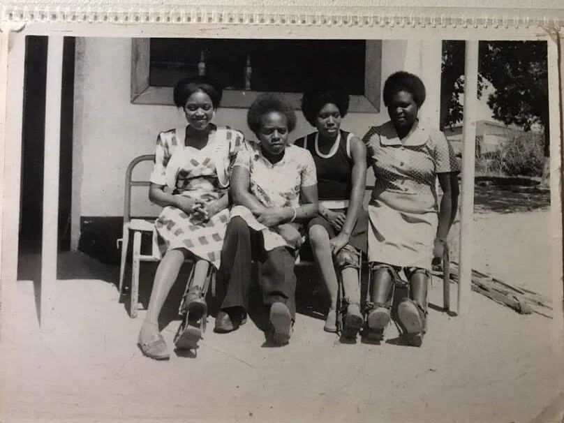 Kwedyo, second from the left, with friends.