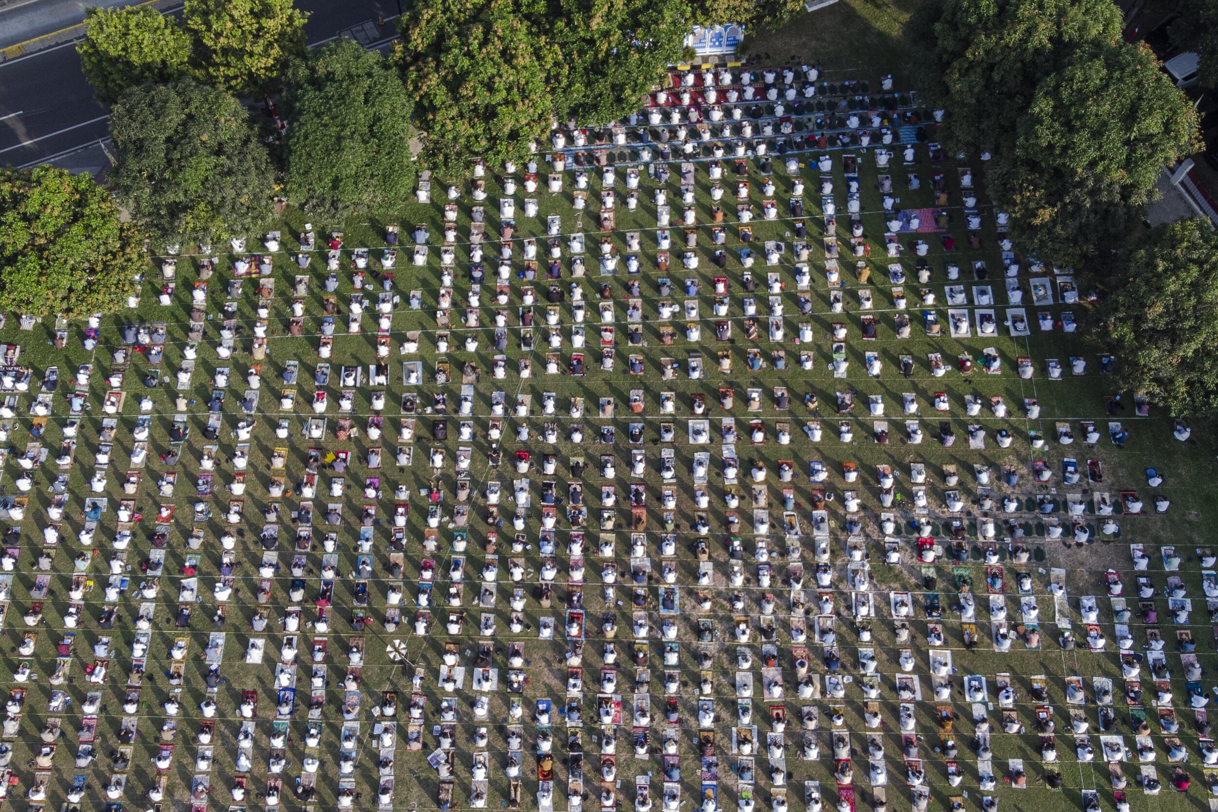  Muslims perform prayer to commemorate Eid al-Adha with physical distancing as a preventive measure against the COVID-19 transmission. Photo by Agoes Rudianto. 
