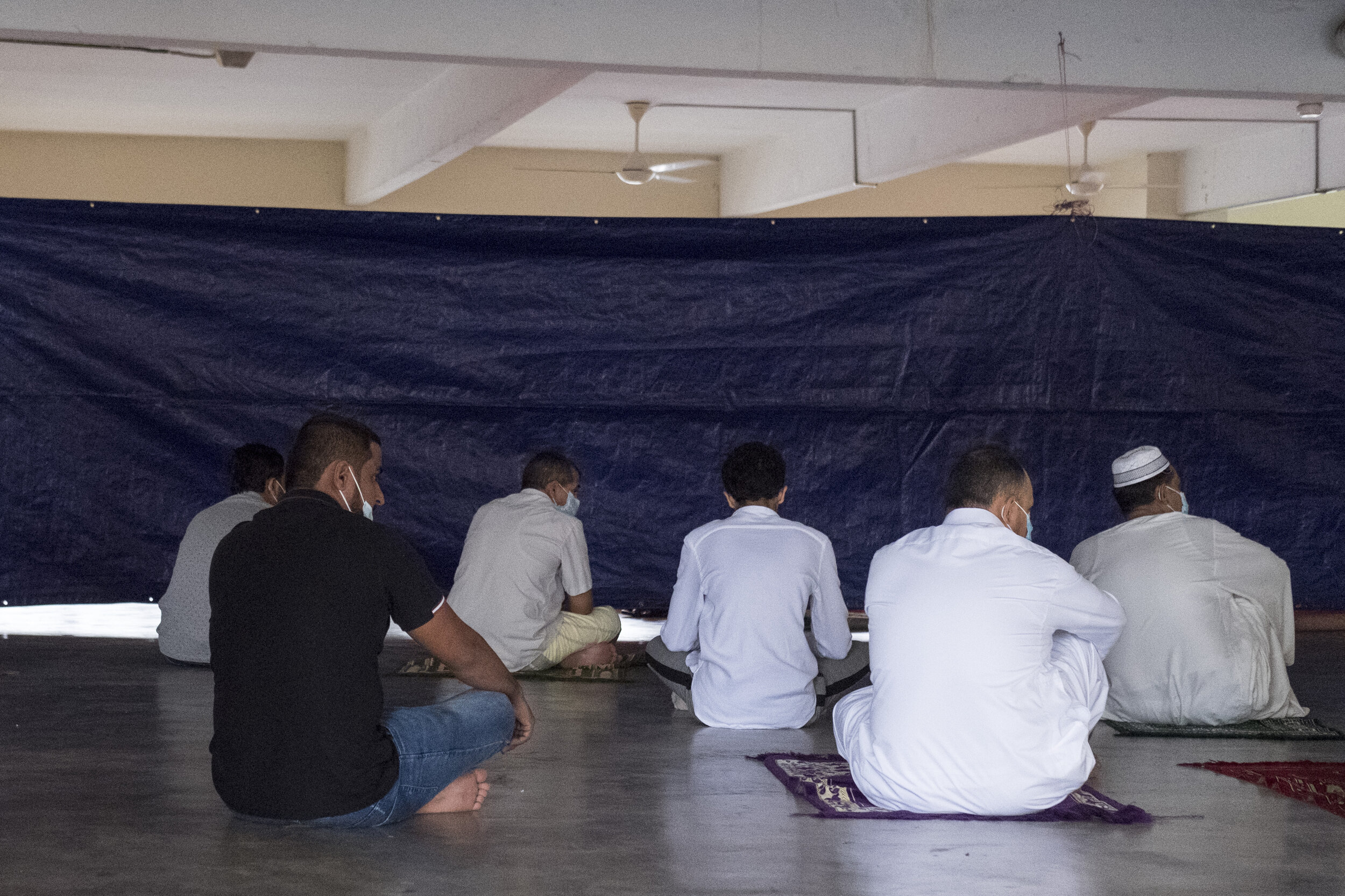  A group of refugees prayed together on the morning of Eid al Adha. Gatherings larger than 20 people were forbidden for all Malaysians and foreigners. Photo by Alexandra Radu. 