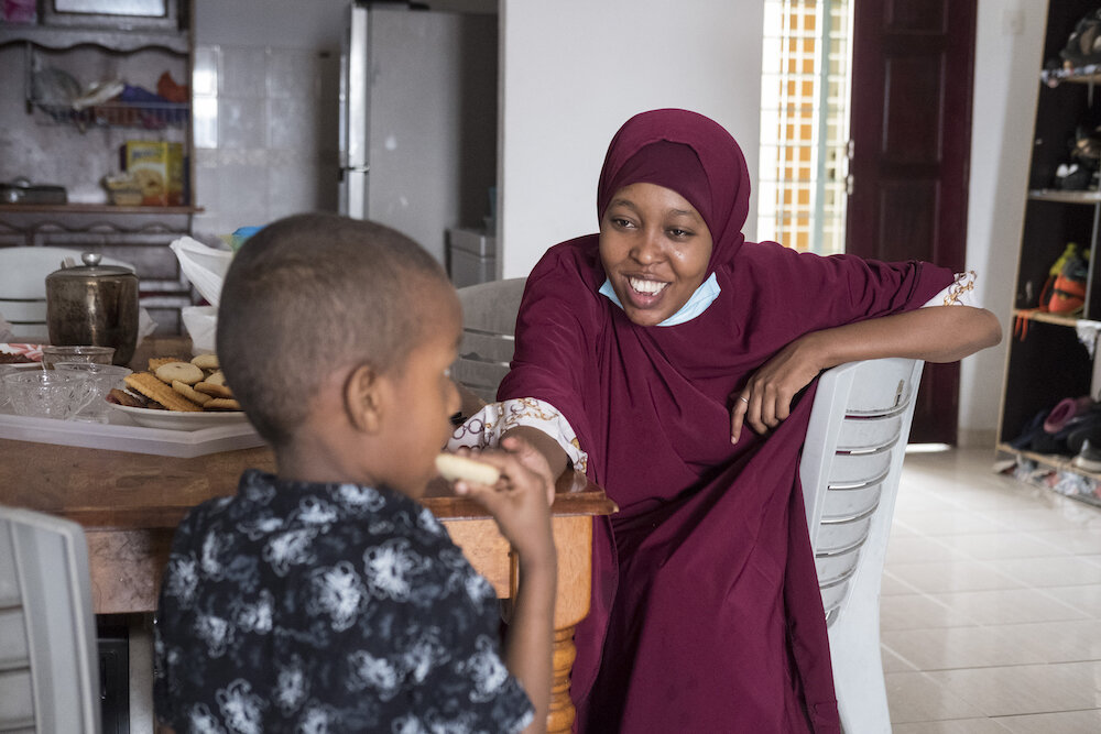  Ridwan, 22, a teacher at a refugee school in the Somali community, visits the family of one of her students during a during a food distribution program run by the Somali Refugee community centre on Eid al Adha. “I miss my students, I haven't spent t