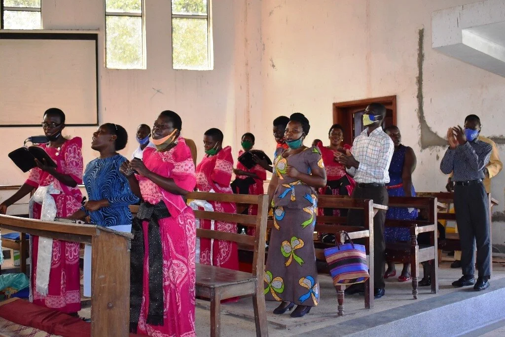 The choir at St. Mark’s Church of Uganda sang hymns for the congregation at the church’s first reopening since the COVID-19 lockdown. Photo by John Semakula.