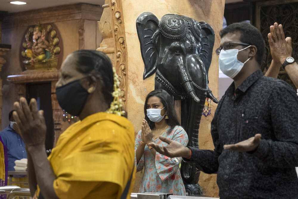  Hinds pray on the morning of Diwali at the Court Hill Ganesh Temple, one of the oldest and most famous Hindu temples in Kuala Lumpur. Photo by Alexandra Radu. 