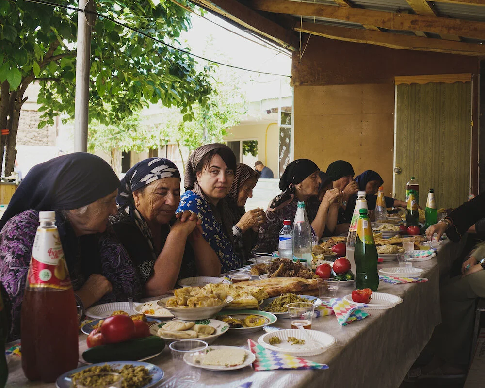 After the zikr on Aug. 5, 2021, people gather for a Supra for the 40th day after the passing of a member of the family of a neighbor. Photo by Julien Pebrel/MYOP.