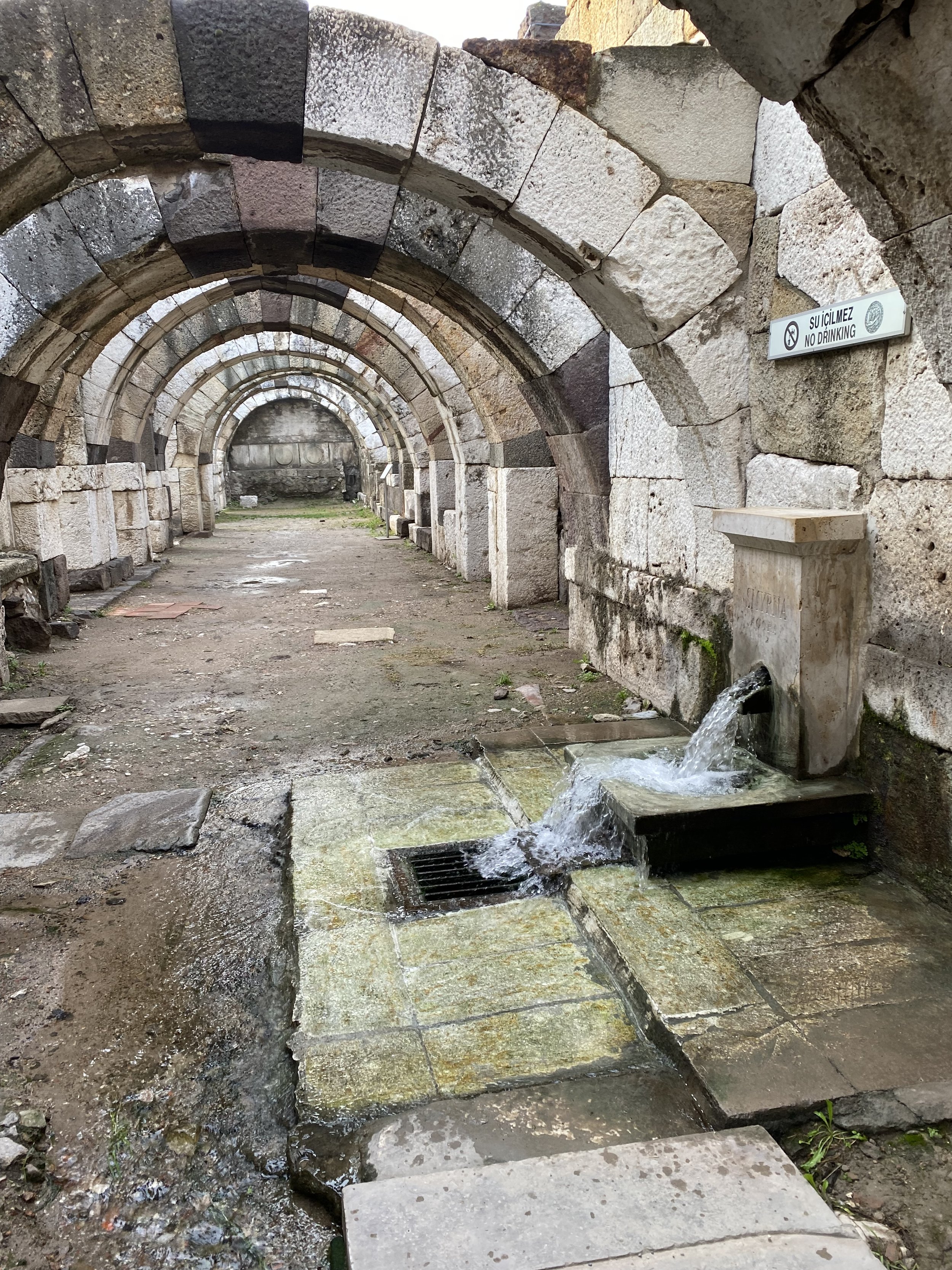  Restored market arches and a working fountain at the ruins of Smyrna.