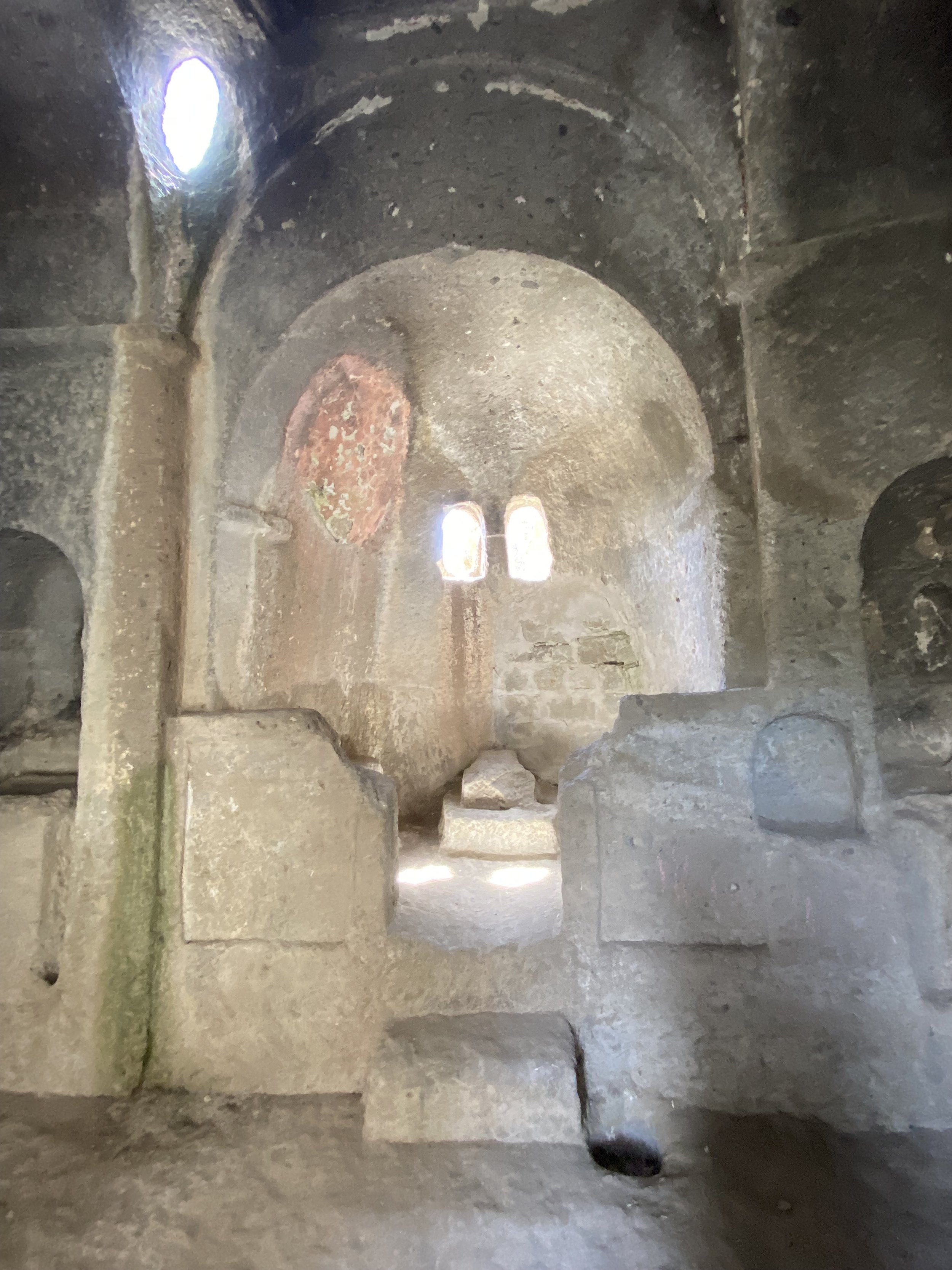 An ancient chapel carved inside the volcanic rock formations of Kilistra.