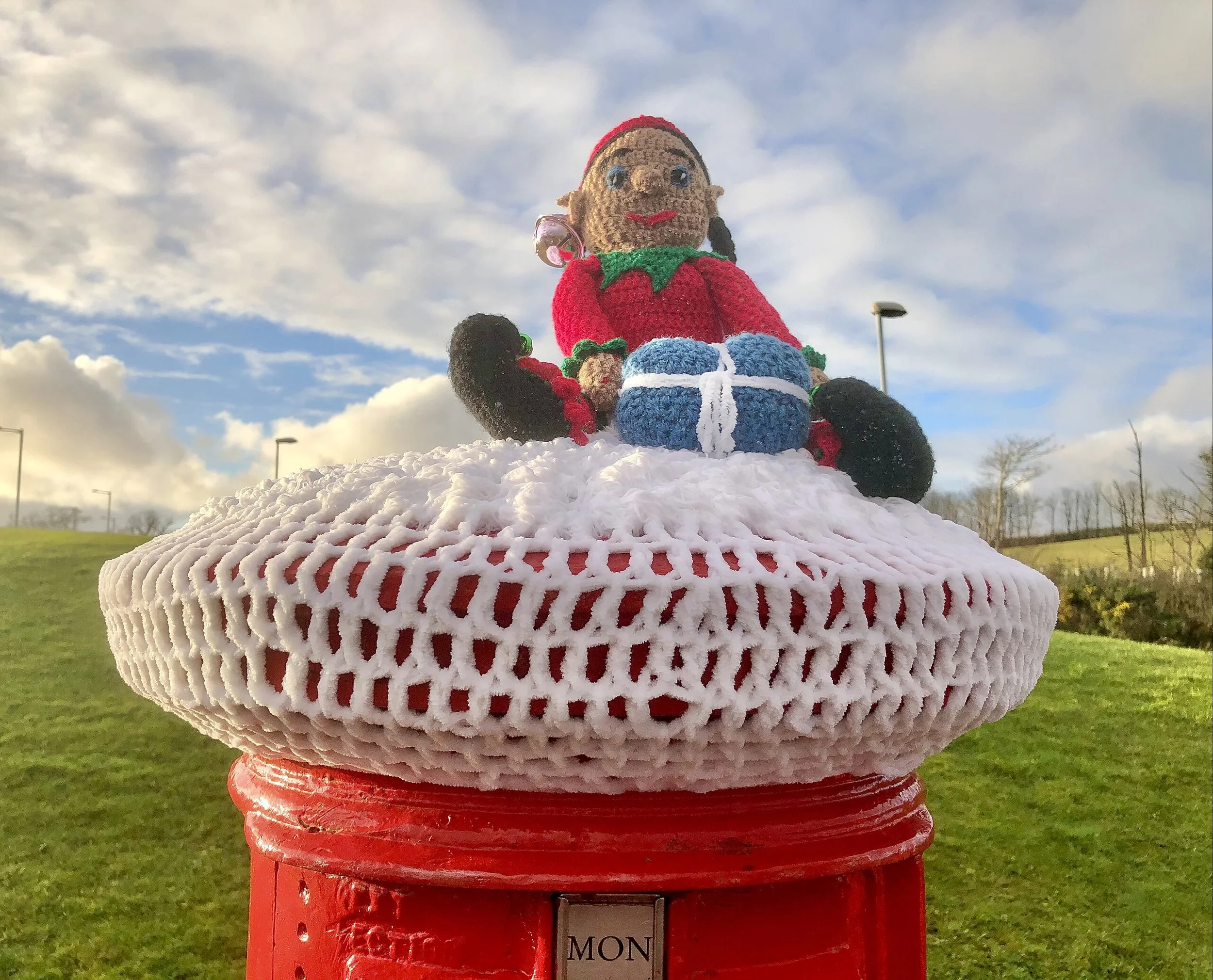Crafty Residents ‘Yarn Bomb’ Postal Boxes For Holiday Cheer
