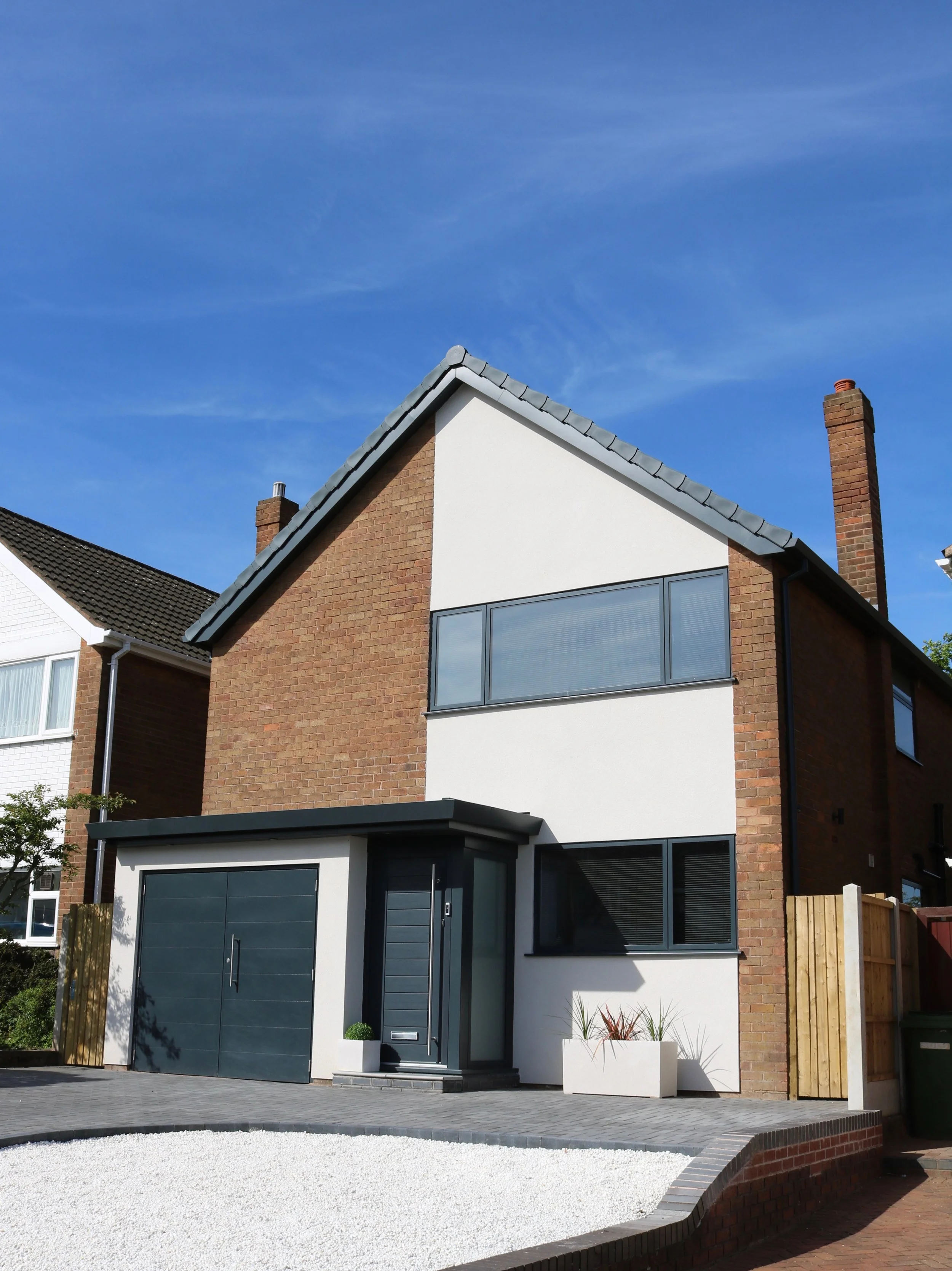 cedar clad rear extension with internal layout alterations and updates to front elevation to property in Penn, Wolverhampton. The result is a crisp, modern external appearance combined with a comforta
