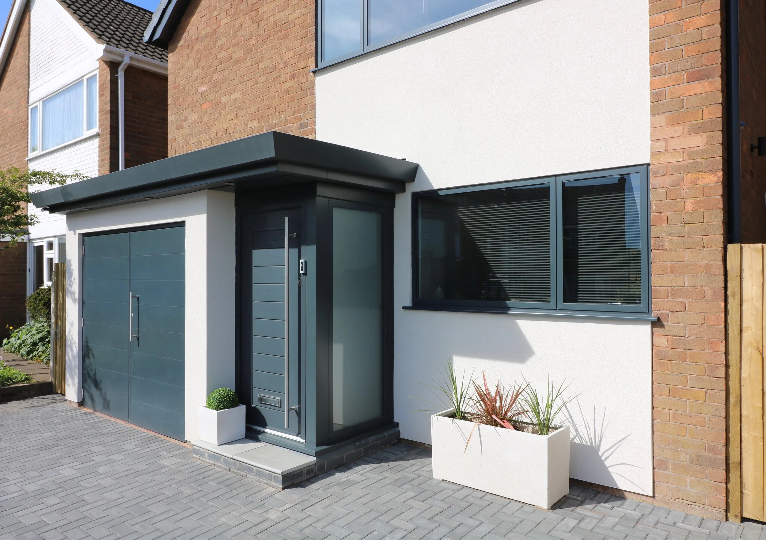 cedar clad rear extension with internal layout alterations and updates to front elevation to property in Penn, Wolverhampton. The result is a crisp, modern external appearance combined with a comforta