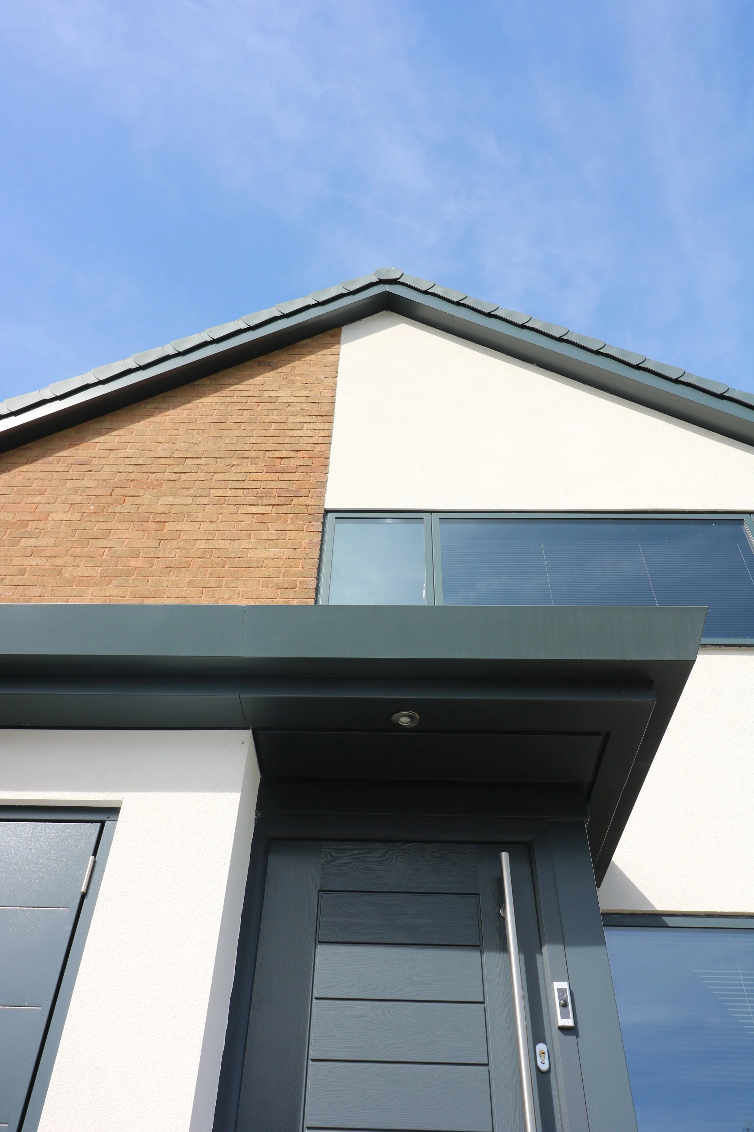 cedar clad rear extension with internal layout alterations and updates to front elevation to property in Penn, Wolverhampton. The result is a crisp, modern external appearance combined with a comforta
