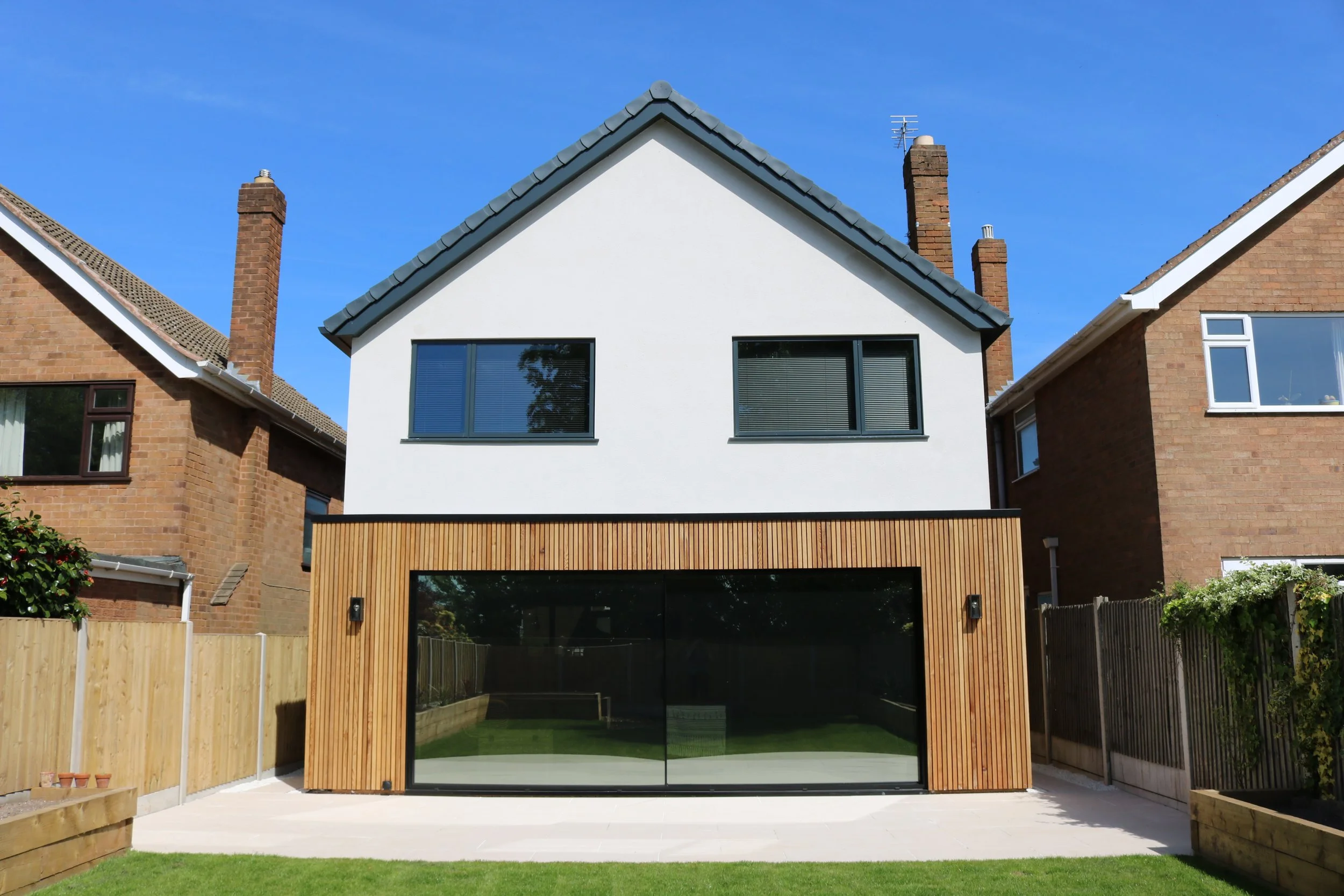 cedar clad rear extension with internal layout alterations and updates to front elevation to property in Penn, Wolverhampton. The result is a crisp, modern external appearance combined with a comforta