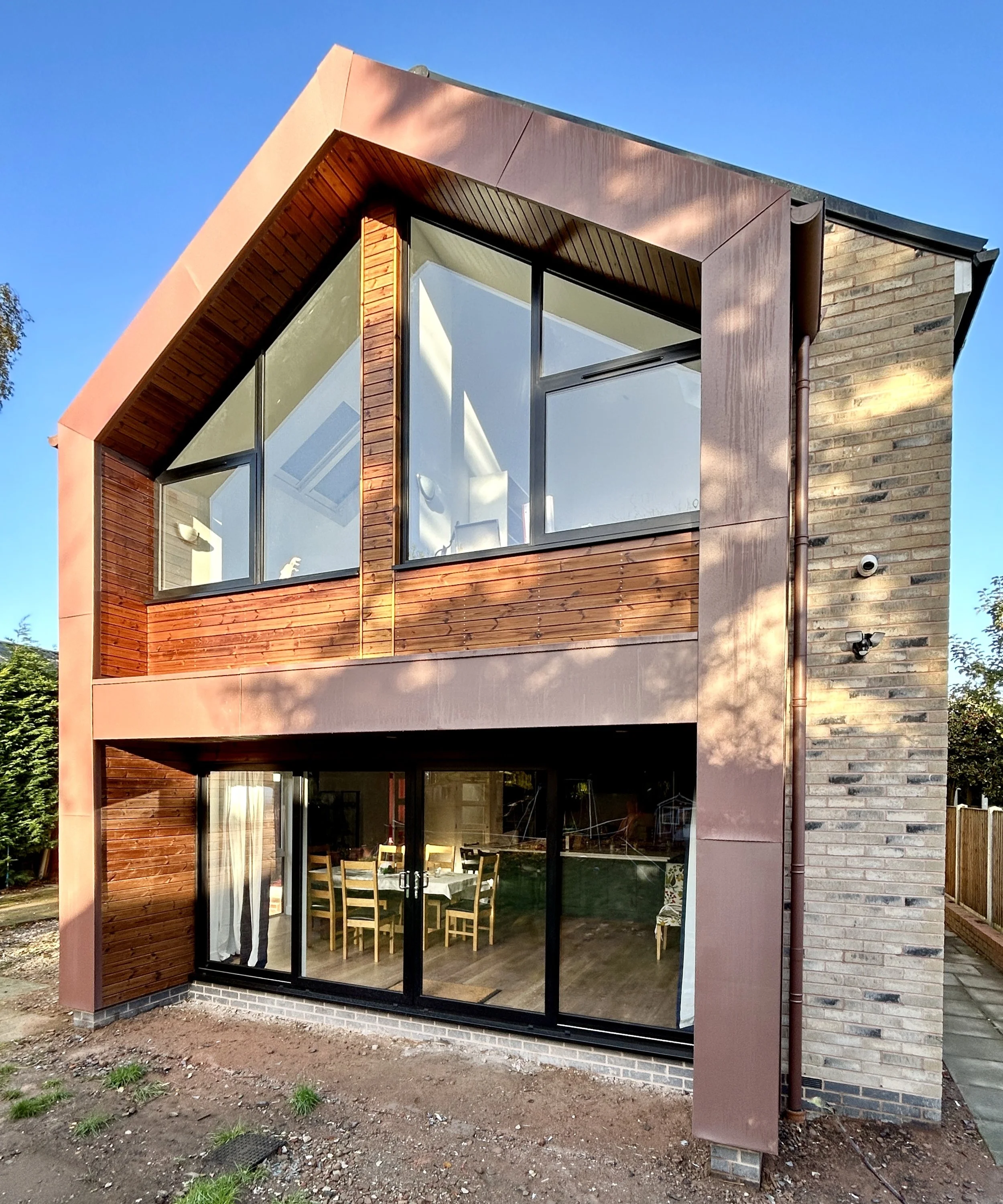 zinc and timber clad contemporary rear two storey home extension in Oldswinford, Stourbridge