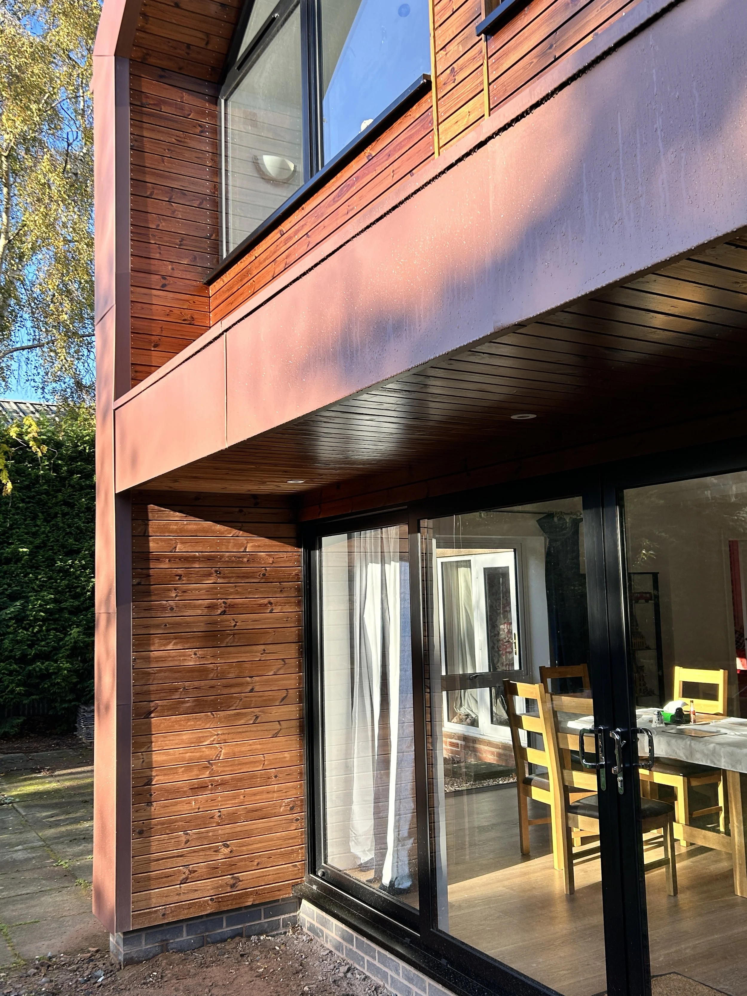 zinc and timber clad contemporary rear two storey home extension in Oldswinford, Stourbridge