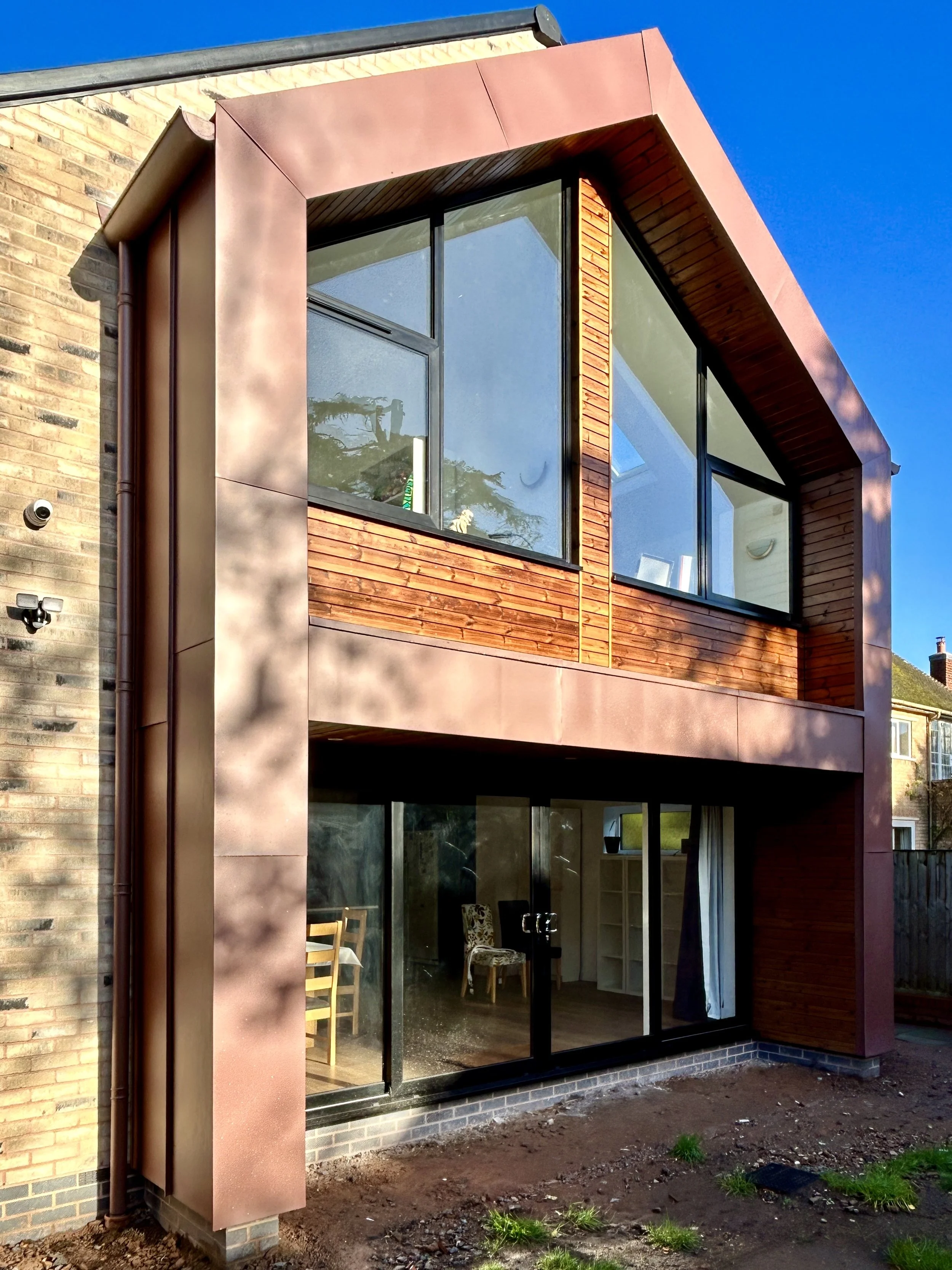 zinc and timber clad contemporary rear two storey home extension in Oldswinford, Stourbridge
