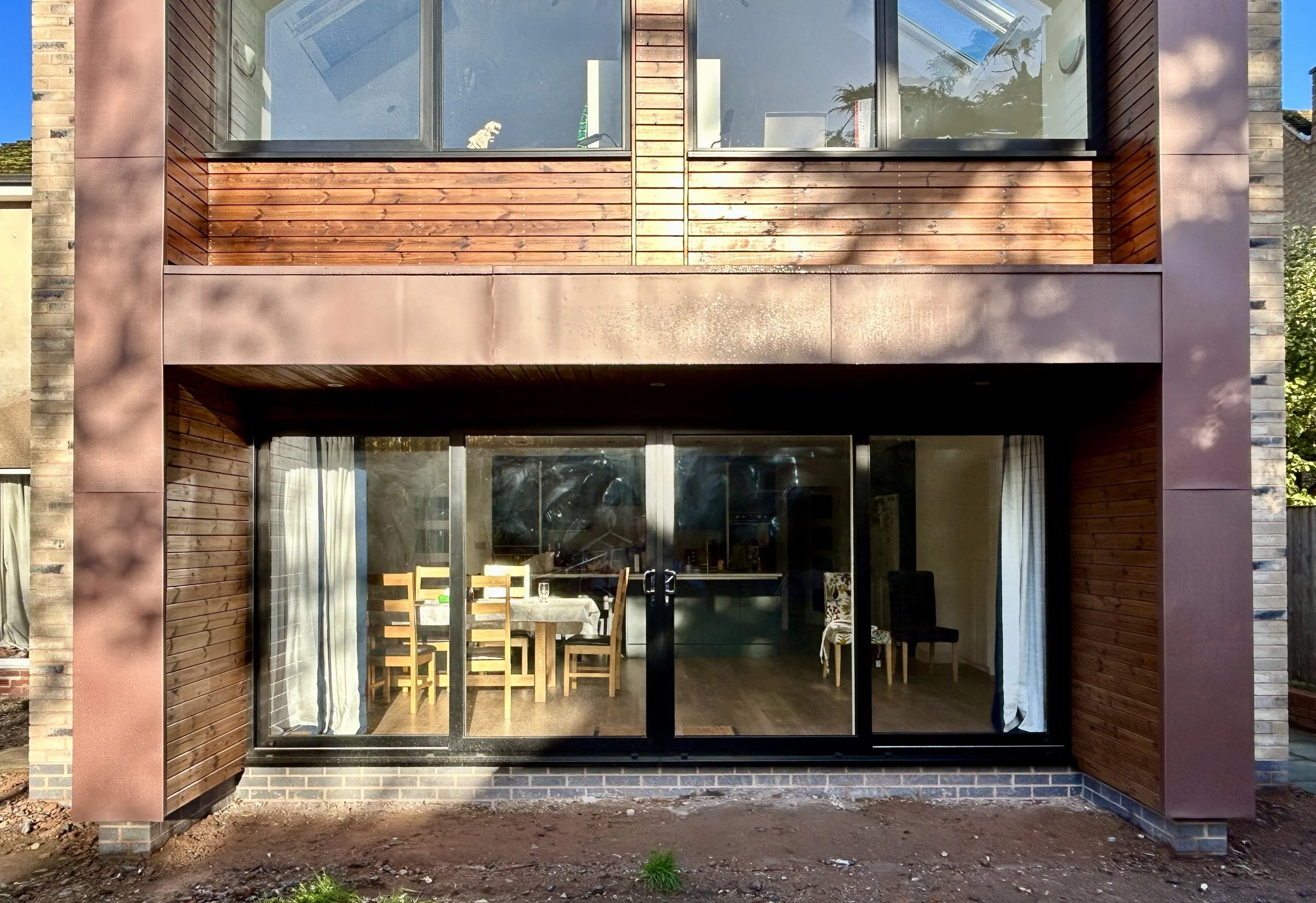 zinc and timber clad contemporary rear two storey home extension in Oldswinford, Stourbridge