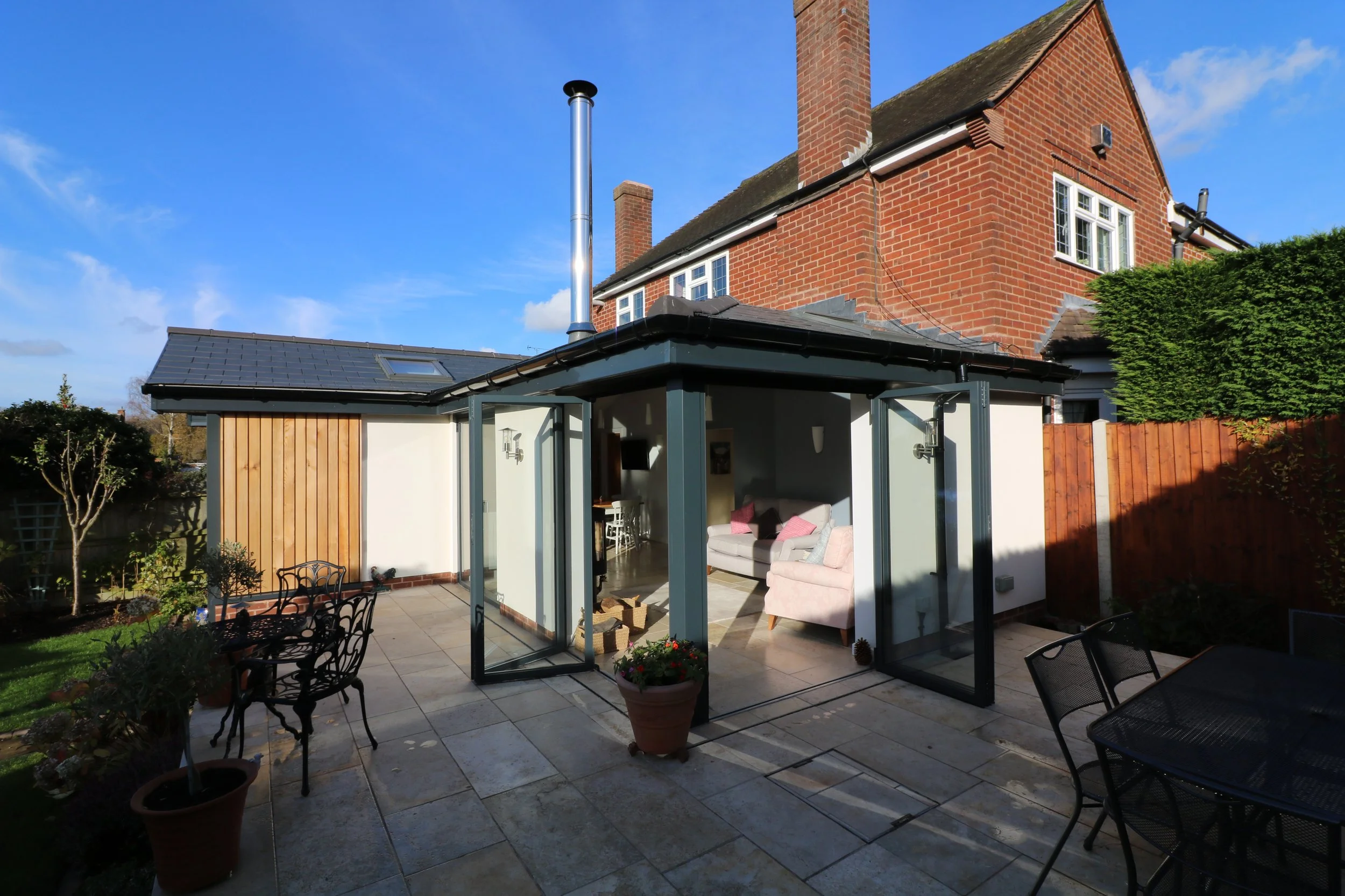 bespoke contemporary open plan garden room extension to property in Pedmore, Stourbridge. The extensions include corner to corner bi-fold doors, vaulted ceilings and a simple material palette o (Copy)