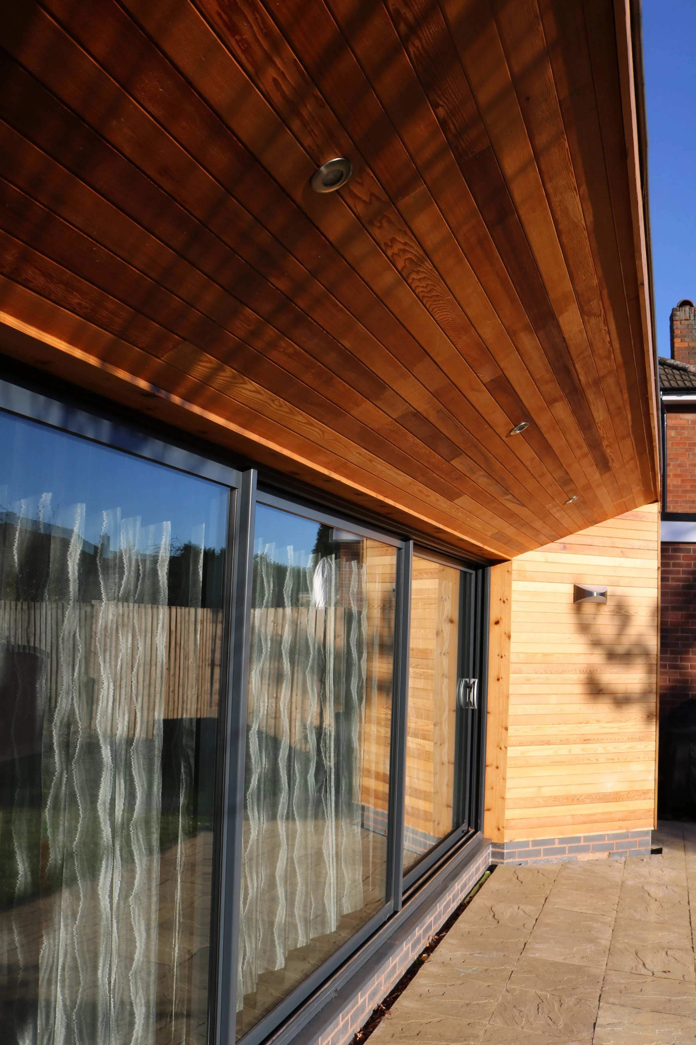 Contemporary cedar clad rear extension creating open plan family living space onto garden in Four Oaks, Sutton Coldfield (Copy)